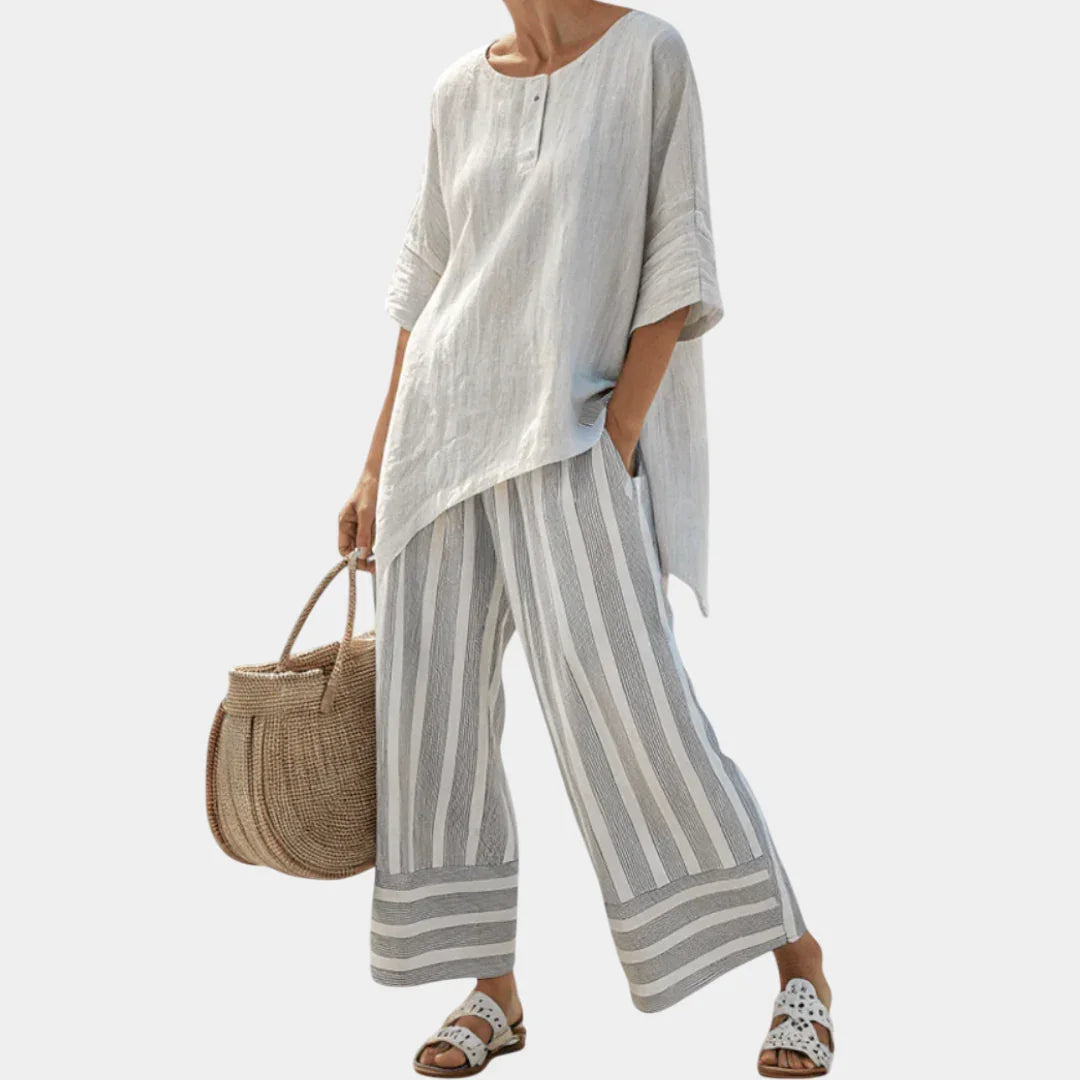 Fiorella | Elegant asymmetrisk bluse og stribede bukser